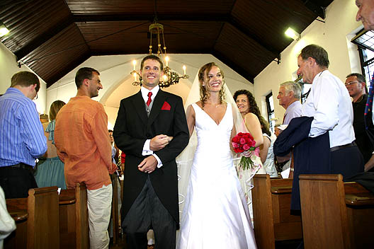 Bride and Groom walking down the aisle at St Peters the Fisherman houtbay