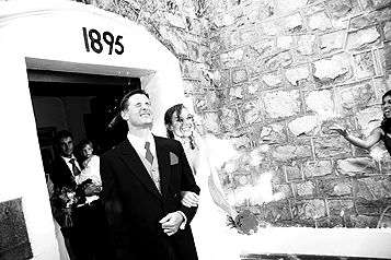 Bride and Groom showered with confetti as they leave the church