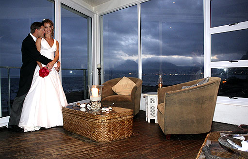 The couple with flae bay clouds moving onto Capepoint in the evening light